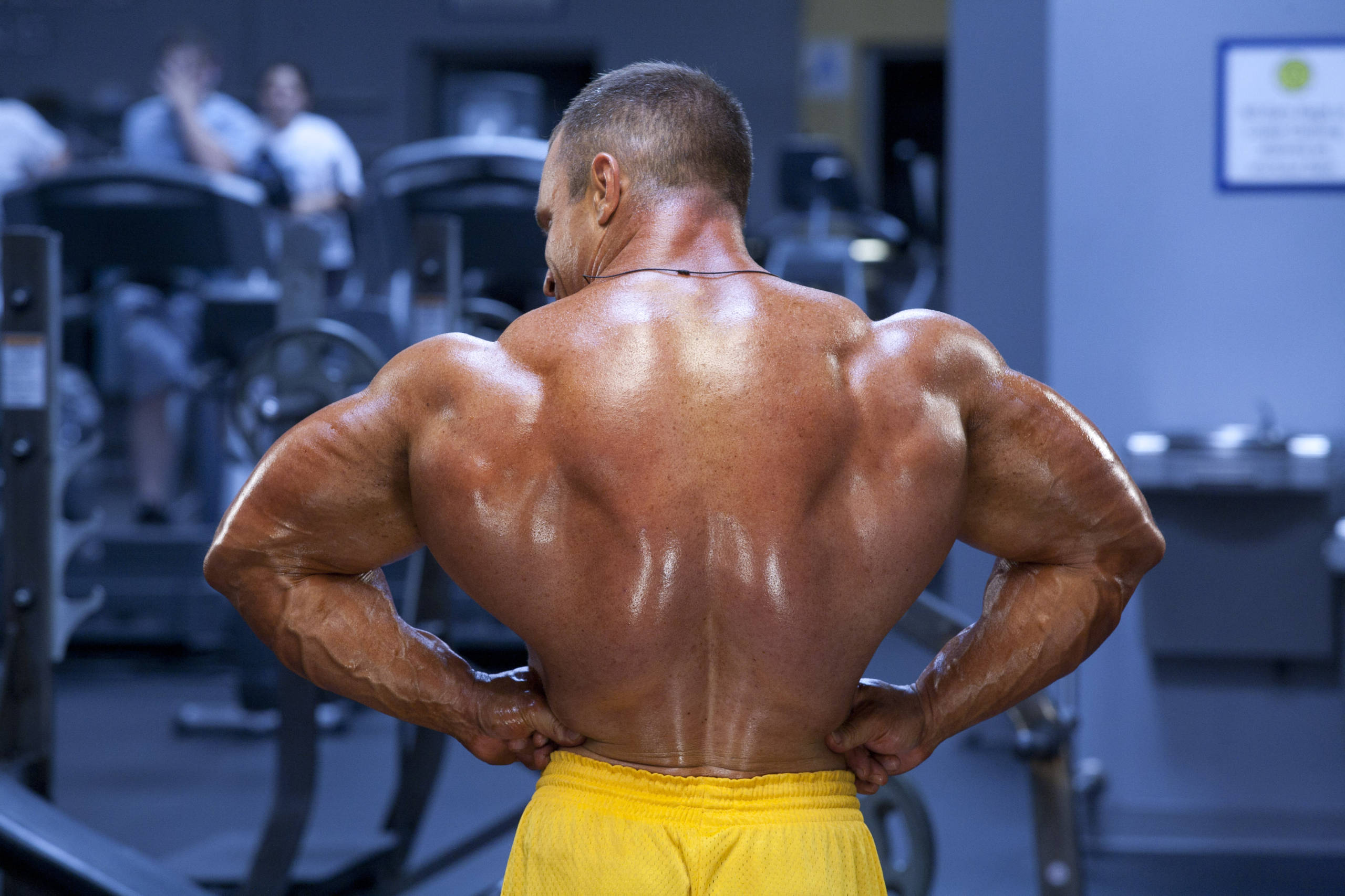 Con Demetriou rear lat spread and thick back structure.