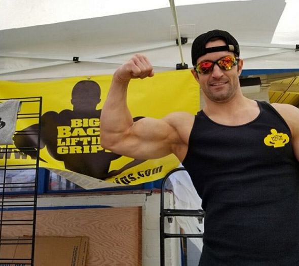 Jade Parnell flexes a bicep at the Big Back Booth Muscle Beach Venice
